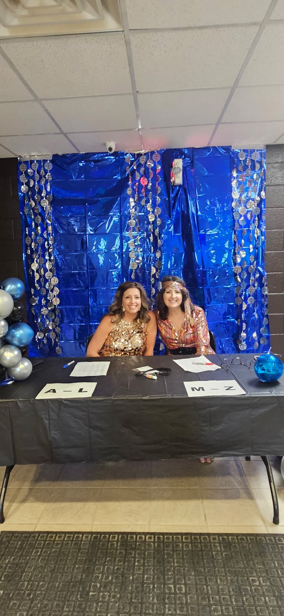 MedinaCHF volunteers at the Teen Dance check-in table